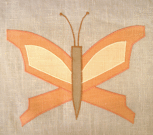 Butterfly: a classic here in tangerine, pale yellow & antique gold, this geometric butterfly would work well in a bedroom or living room. 8" wide x 7" high, $40 per motif.