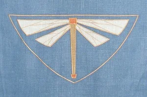 Dragonfly: an Arts & Crafts mascot, shown here in sage, tangerine and antique gold on wedgewood custom linen. Body of dragonfly is 8 inches long, $40 per motif.