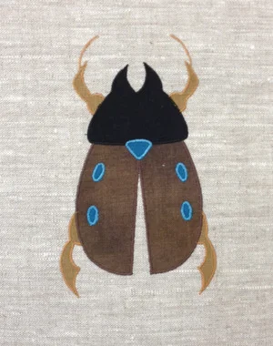 Scarab: Shown here in brown, teal, black and antique gold. $40.00 per motif.