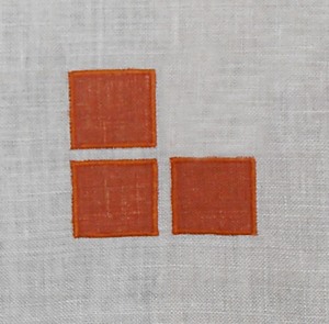 Three Square: sometimes the simplest idea is the best. These three squares of color, appliqued at the inside corner of a pair of curtains or at each corner of a single panel might be just enough accent for your room. Each square is 1 1/4 inches. Also available as a stencil design. (3 inches x 3 inches) $20.00 per motif.