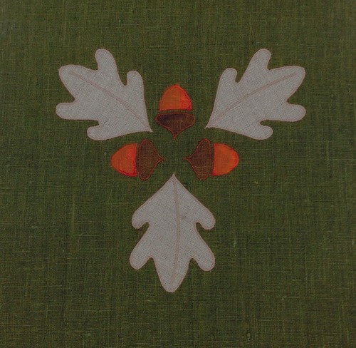 Acorn Medallion : Shown here in natural linen with brown and rust. this can make a nice composition with the Acorn Single, eight inches x eight inches. $45.00
