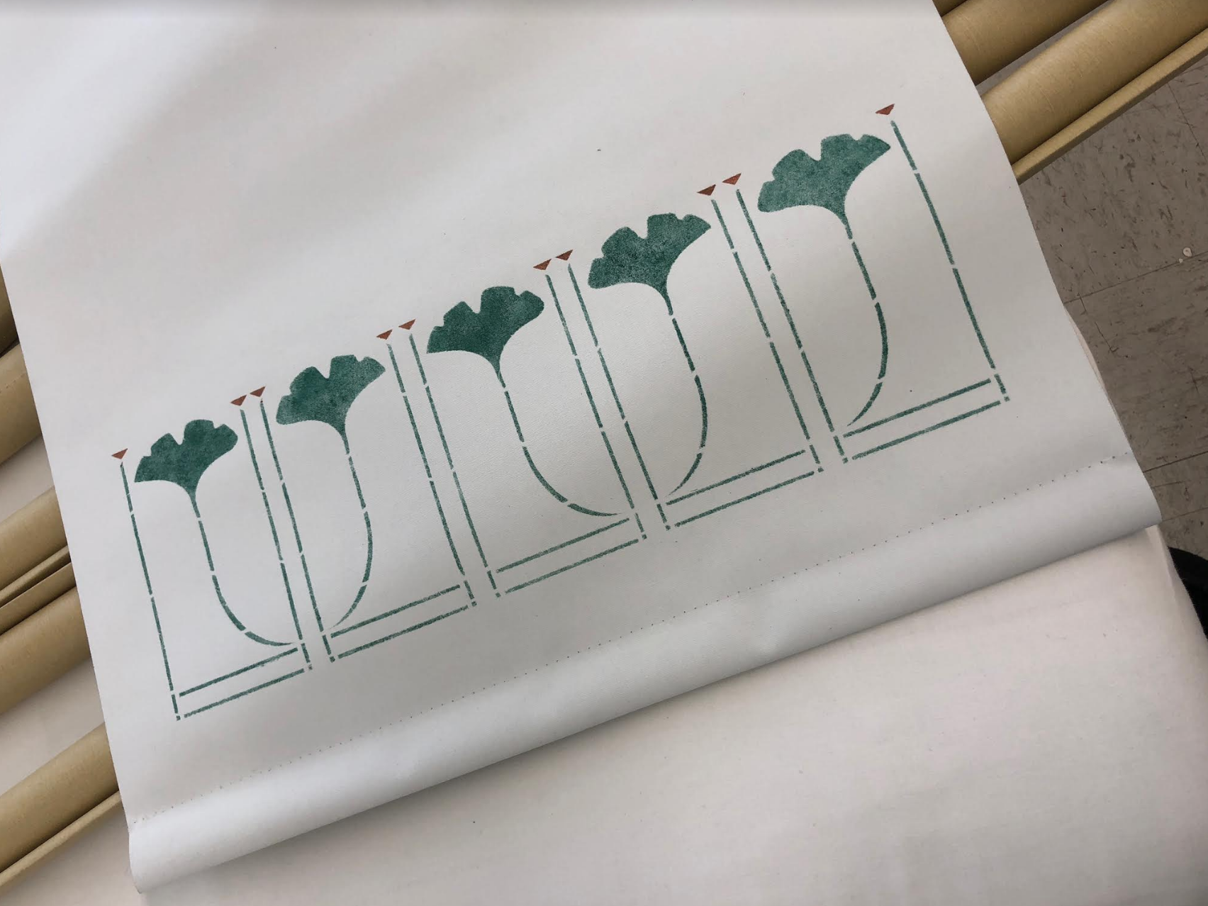 Here is a detail of our Small Gingko Border stencil in forest and mahogany on our Classic Cotton Light Blocking - White.
