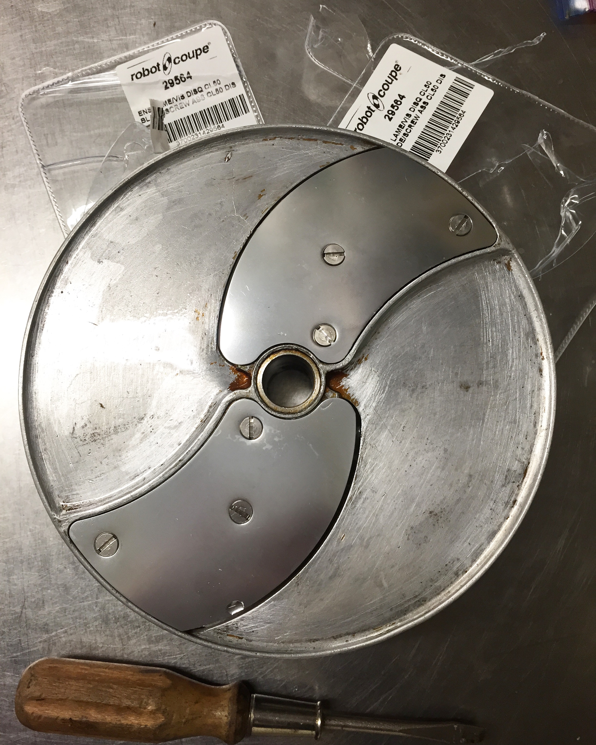 Cleaning blade, replacing blades for industrial food processor to make sure all goes smoothly.