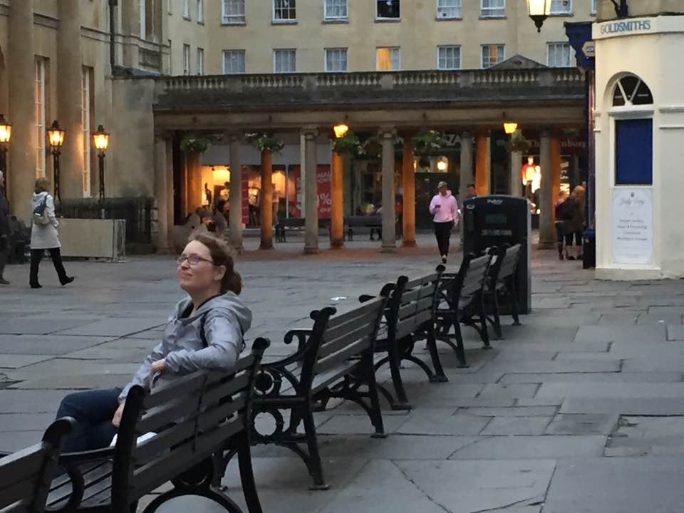 Julie Gard watches night approach the Bath abbey.
