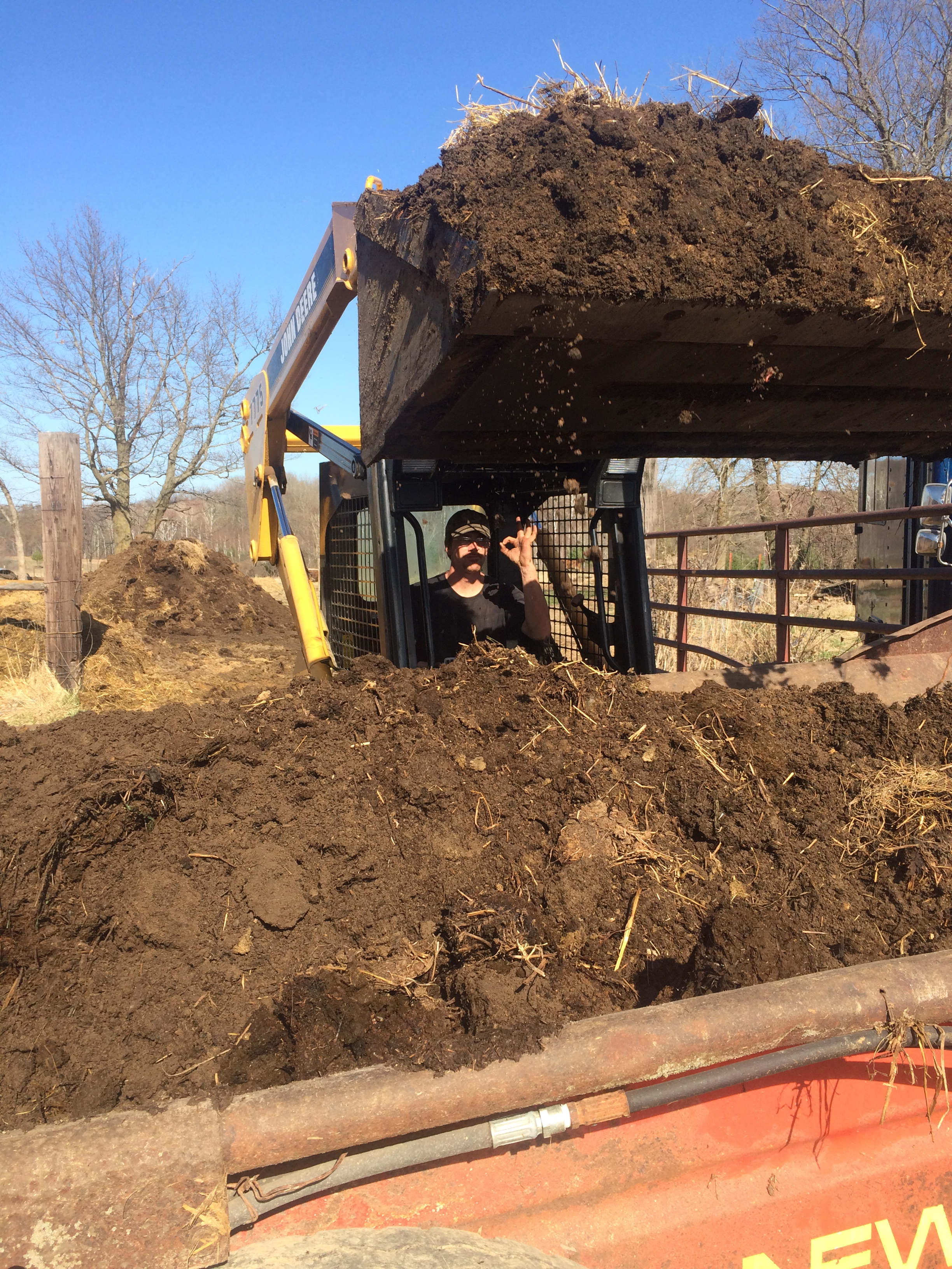  Farmer Josh moving our farm based fertility to the compost pile. 