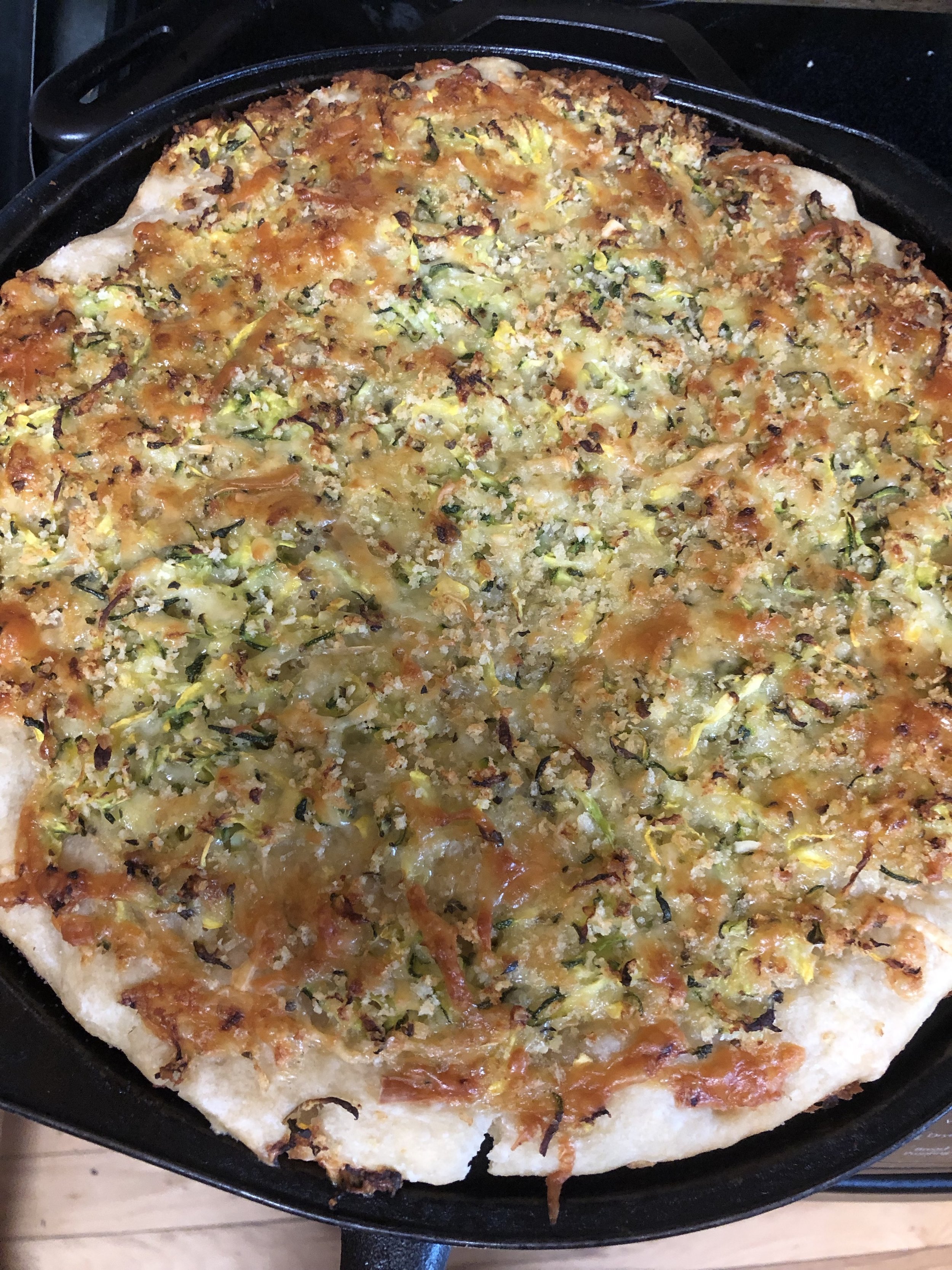  shredded zukes and summer squash cheese and breadcrumbs on pizza dough.  Very Yummy!  Recipe link in last weeks blog 