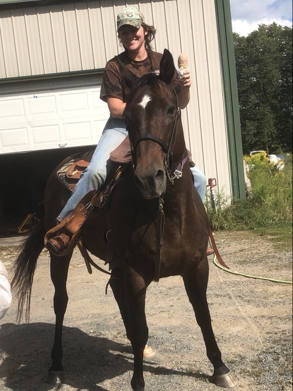  Cow-polk stopped by and enojyed a cone while on horseback 