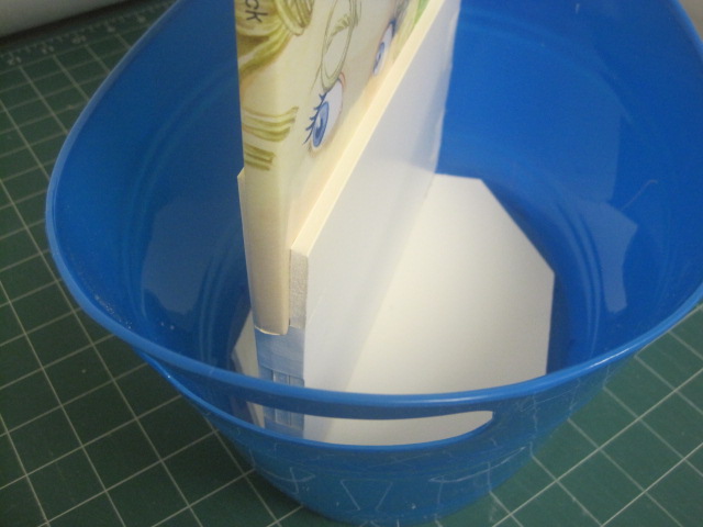  So, first I had to put it all together! It was a trick to have the book stand upright, using my stash of foam core scraps and a glue gun. Here's a peek at my hidden engineering: