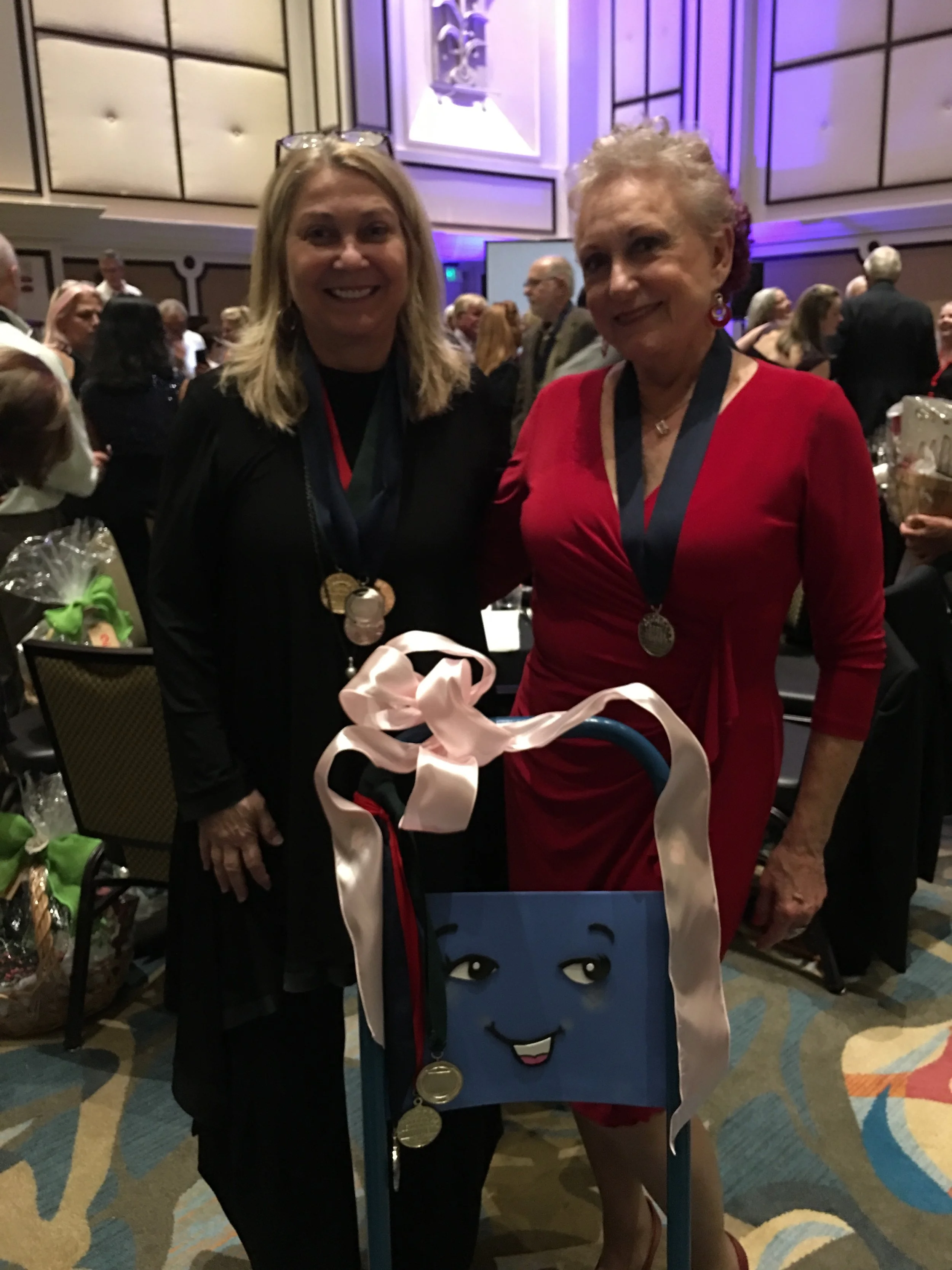 Kay Whitehouse joins Jayne Rose-Vallee for a pose with Dolly the Handcart!