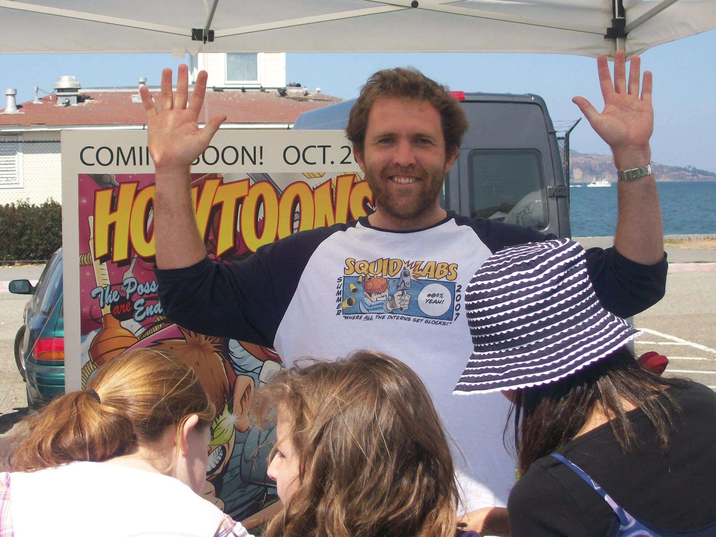  The   Howtoons &nbsp; booth promoted the launch of the book by MacArthur Fellow  Saul Griffith . Part comic strip, part science experiment,   Howtoons   teaches kids the "Tools of Mass Construction", showing them how reimagine uses for common househ
