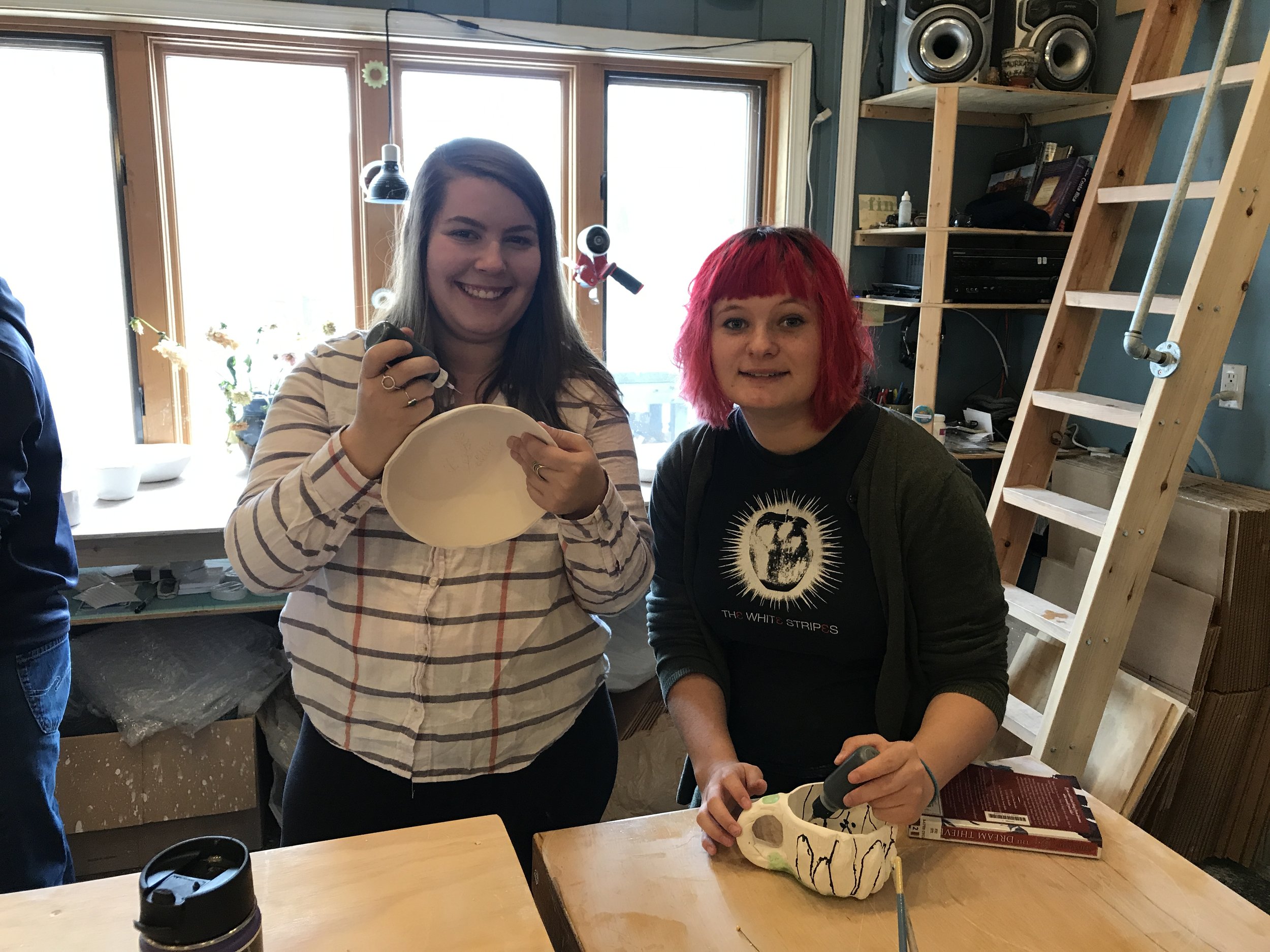 McKenzie and Katie trying their hand at pottery at Gangbusters