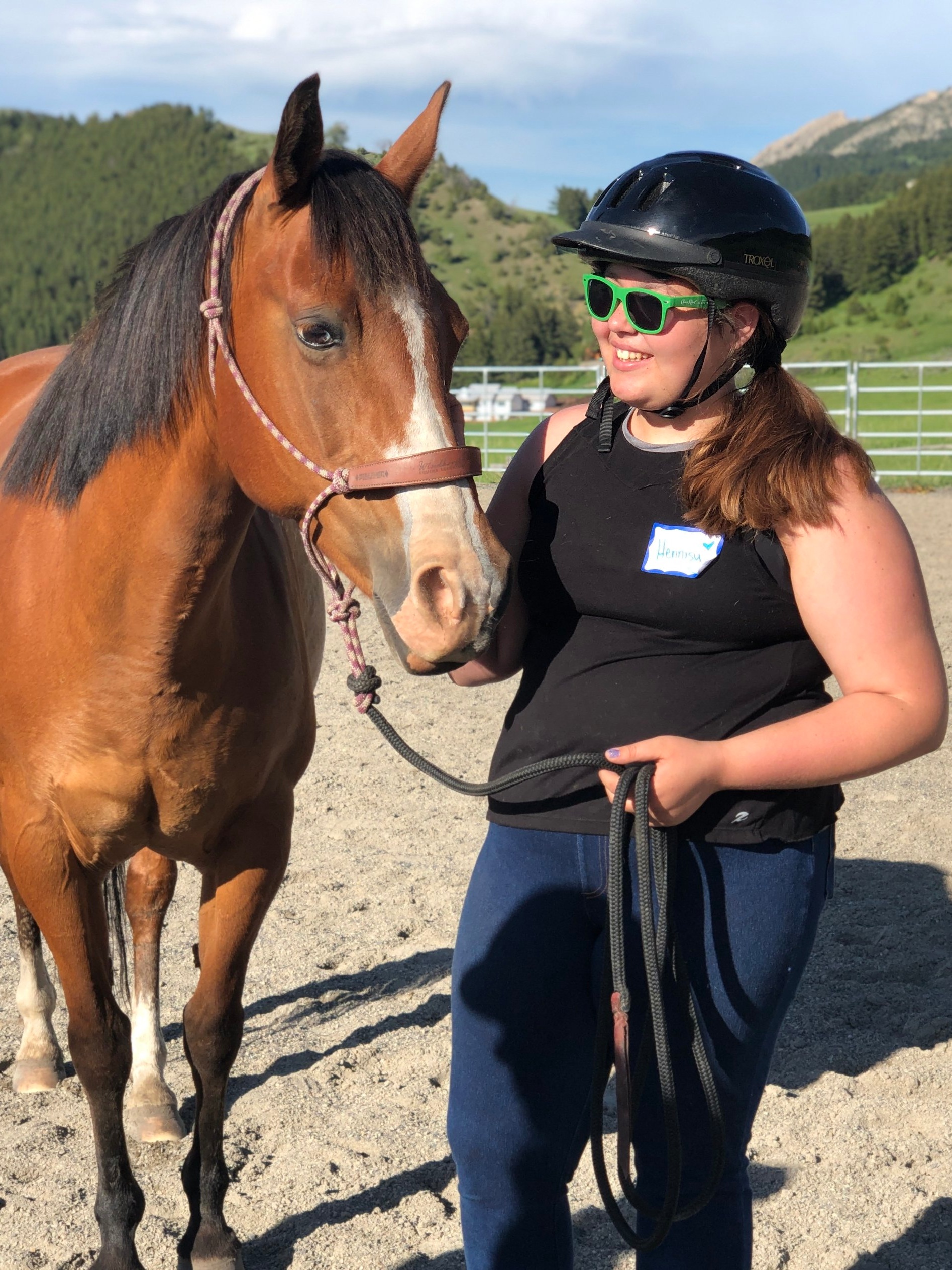 Ella makes a new friend with her partner from Windhorse Equine Learning.