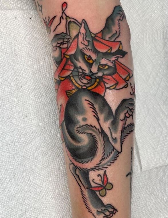 leslie_color_animal_bigcat_flower_neotraditional_illustrative_forearm_cultureal_rabblerousertattoo_losangeles.jpg