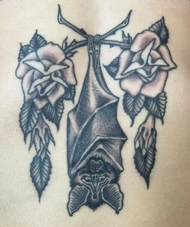 west bat hanging animal black and grey rose branch.JPG
