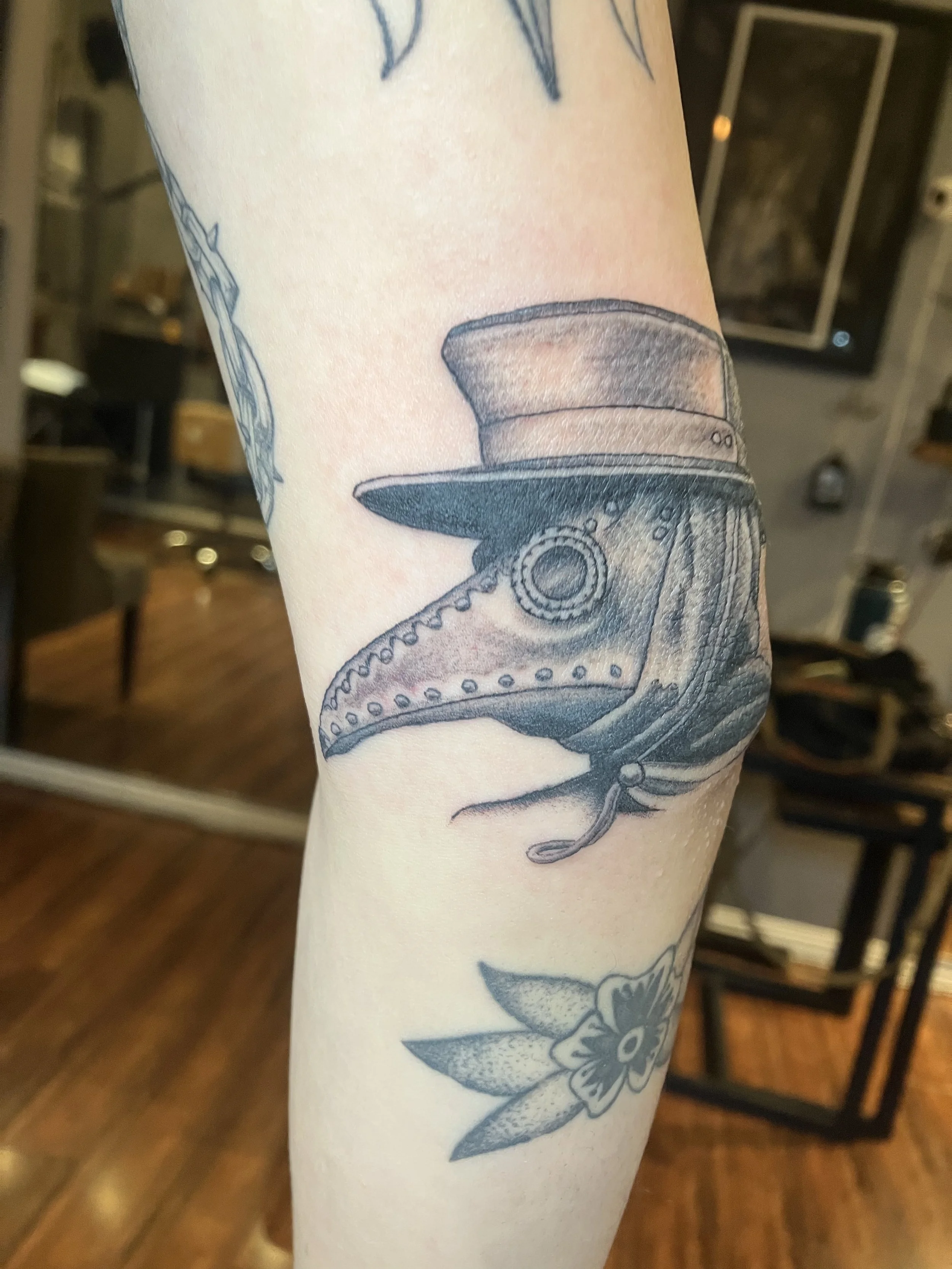 west_los_angeles_tattoo_black_and_gray_plague_doctor_mask_elbow.jpg