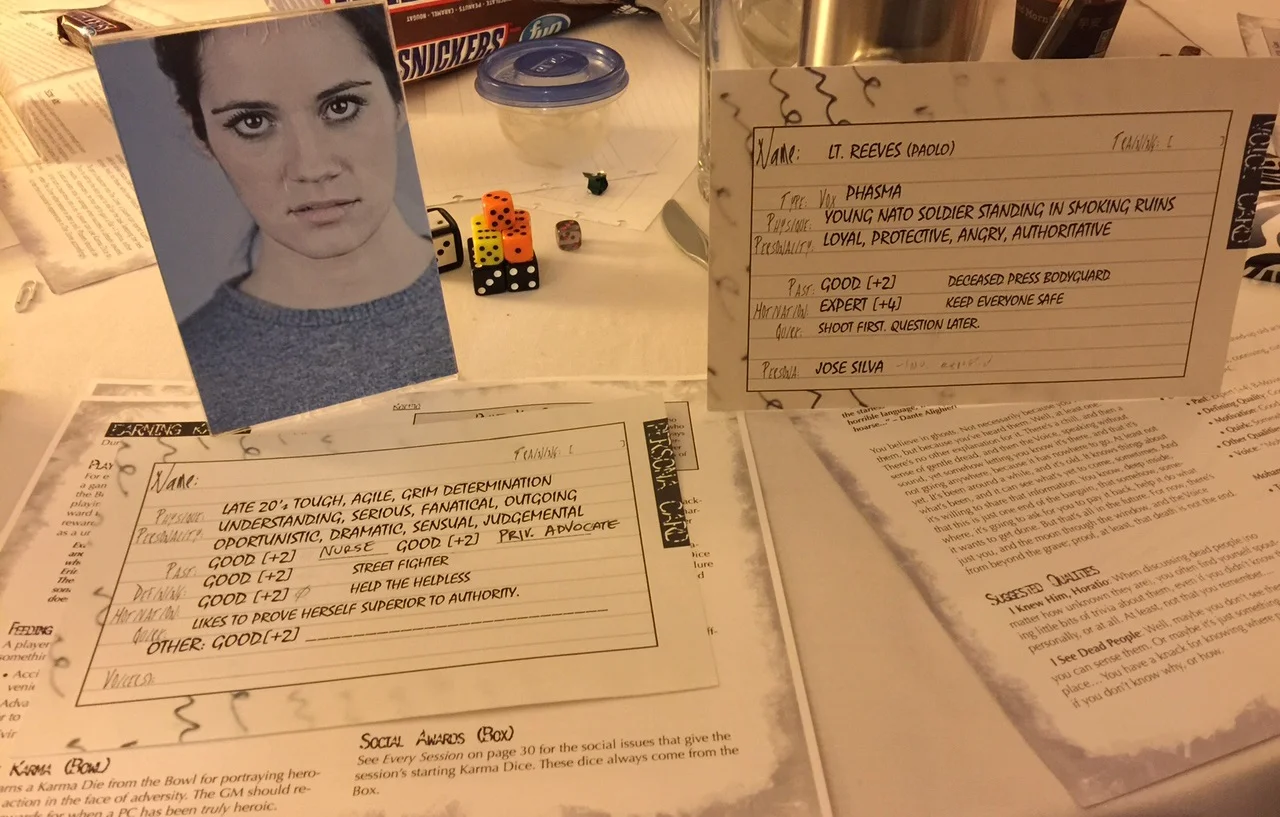 On the left, a picture, and character record with blanks that would slowly get filled out. On the right, a ghost that whispers in the ear of another player.