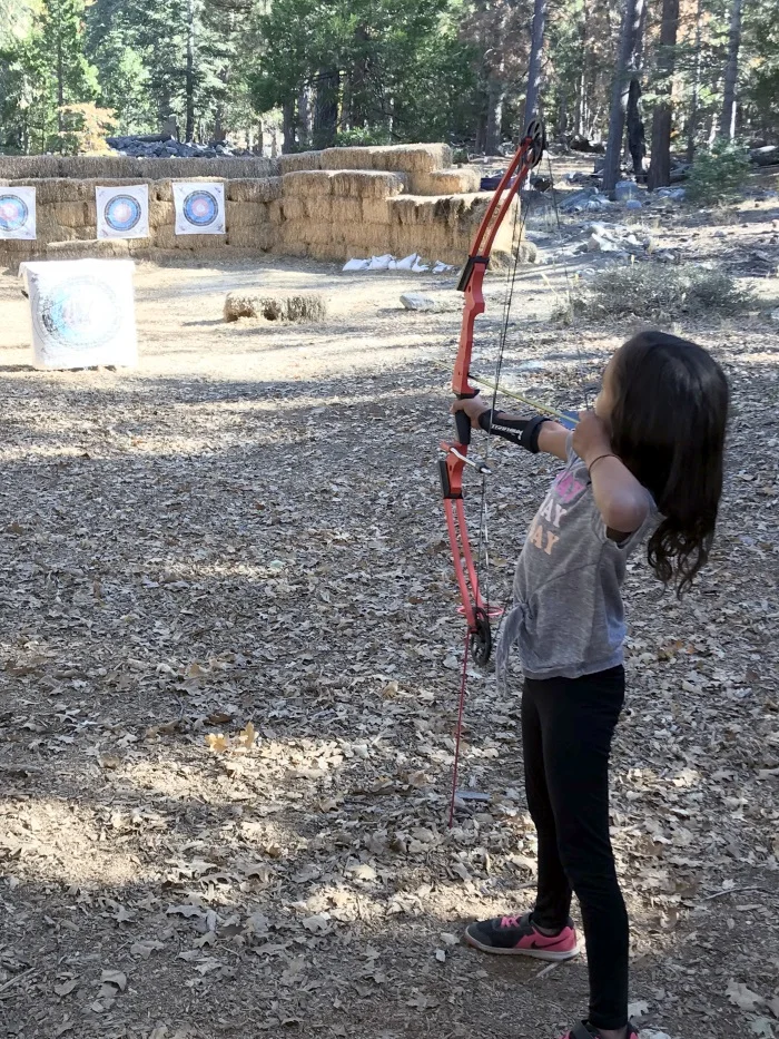 Archery with an adult bow the first day.
