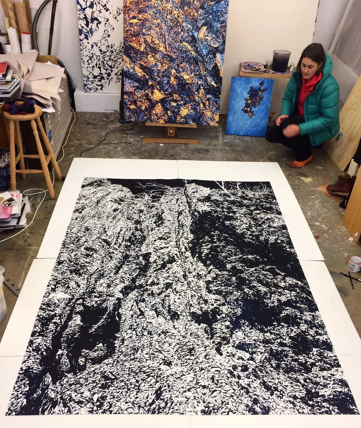 Annika Romeyn in her ANCA Dickson studio with her monotype work 'Chasm 3', 2017