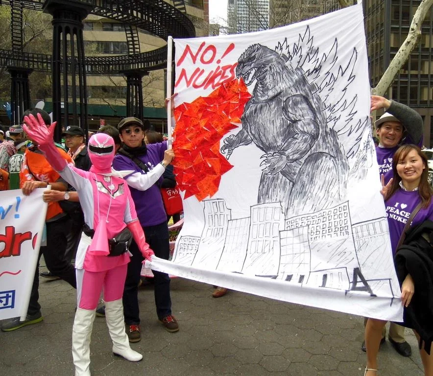 Peace& Planet Rally participants wave goodbye to nuclear weapons, Manhattan, NY.