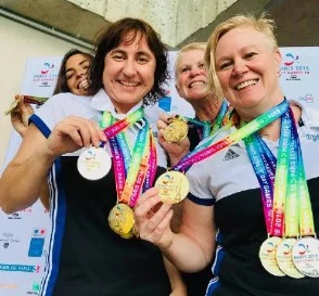 Our successful female swimmers from the 2019 Paris Gay Games. Back: Celia and Janet. Front: Susie and Megan