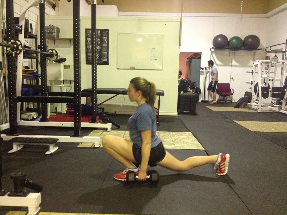 Elite Edge athlete Nicole Clarke demonstrates a proper split squat; one of our progressive exercises towards performing full squats