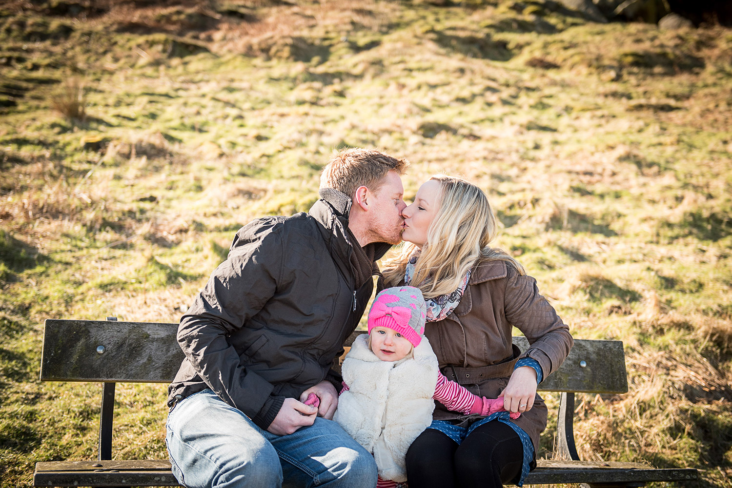 couple kissing during engagement photo shoot on ilkley Moor