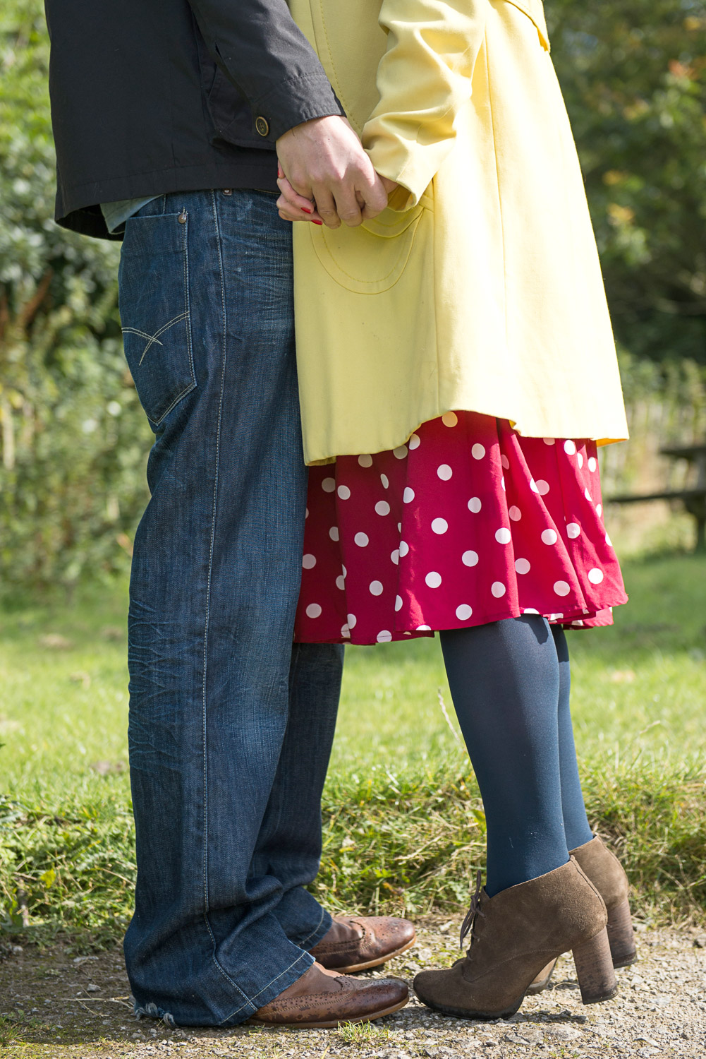 close up of a bride to be on tiptoes to reach her fiancee 