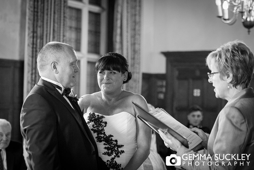 Bride and groom during their wedding ceremony at Monk Fryston Hall