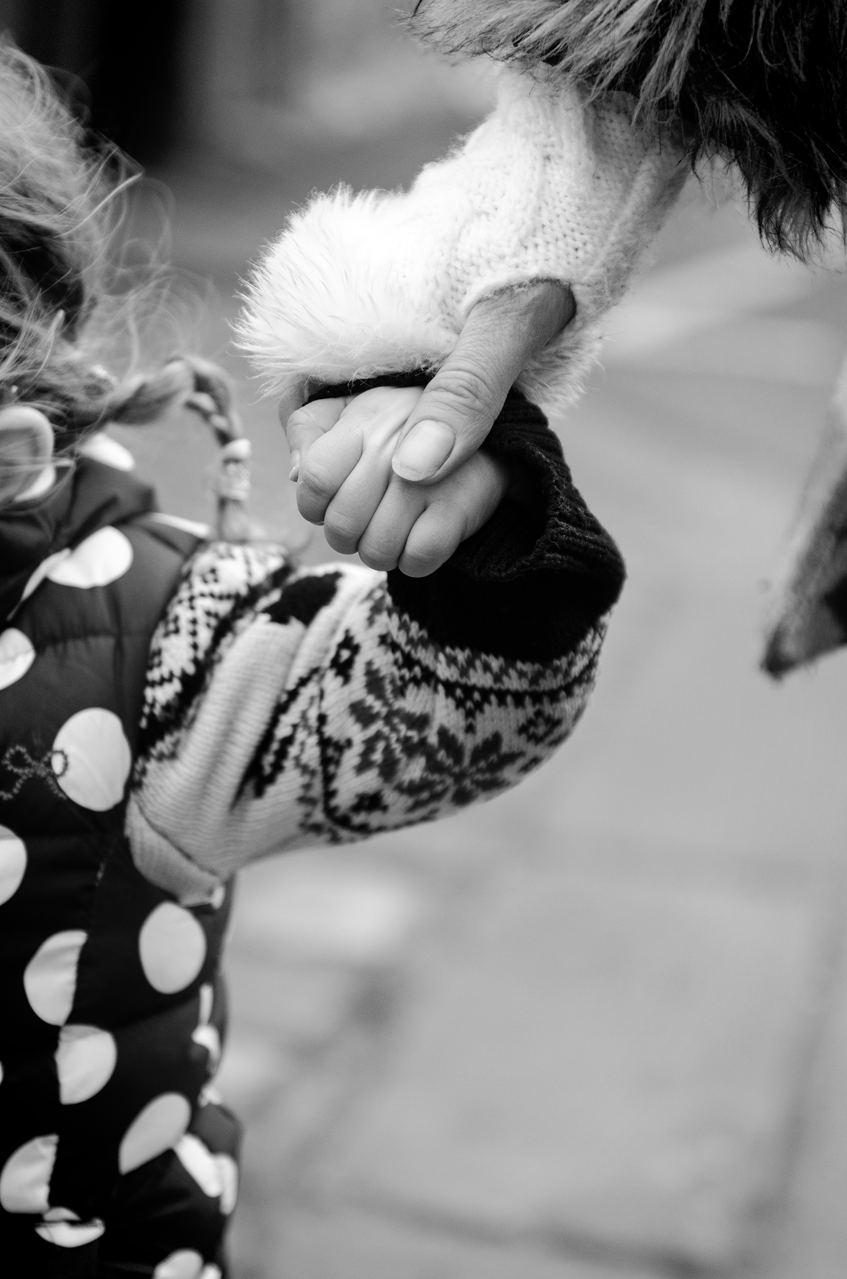 close up photo of mum and daughter holding hands in skipton