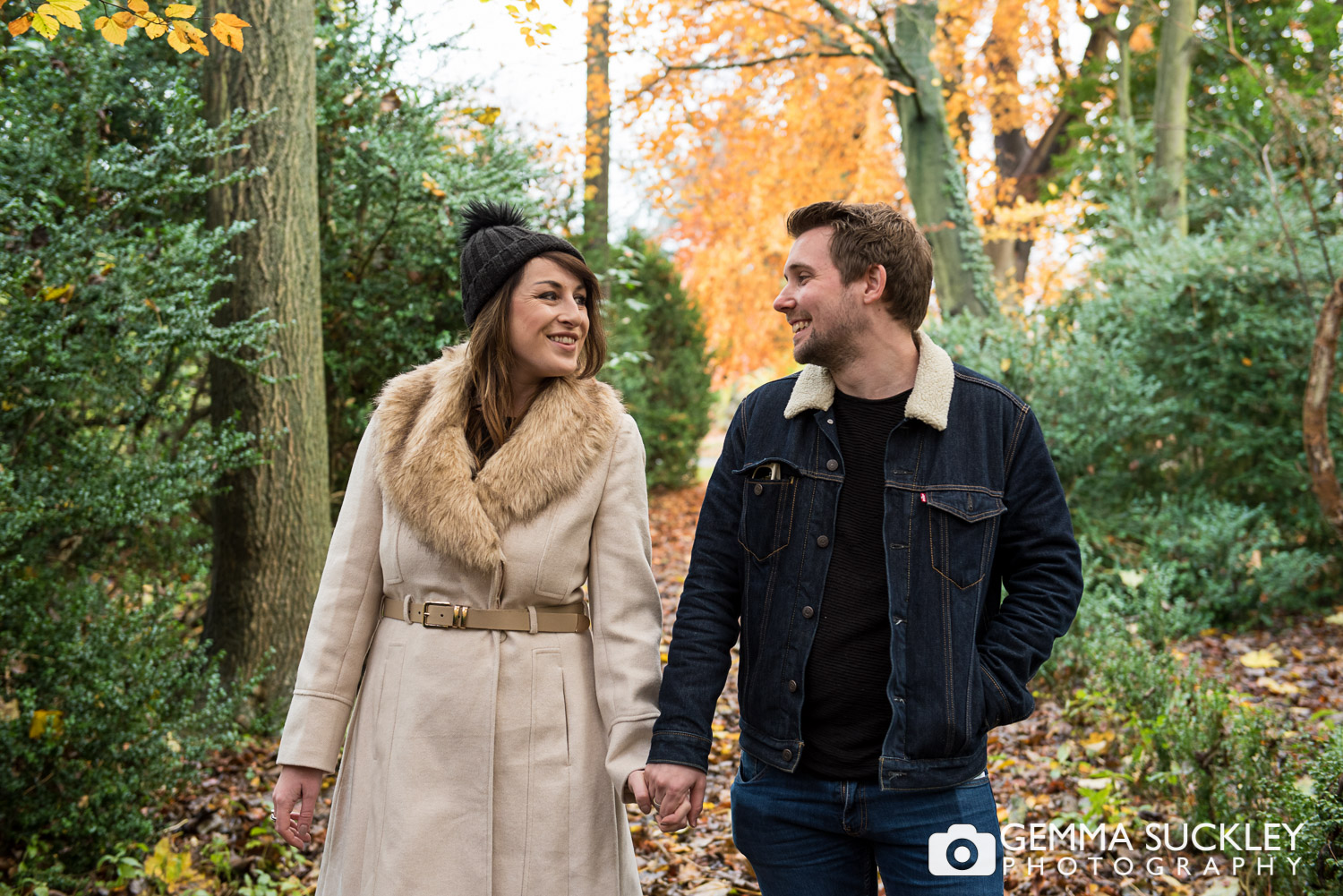 couple walking through a the gardens at Hazlewood Castle