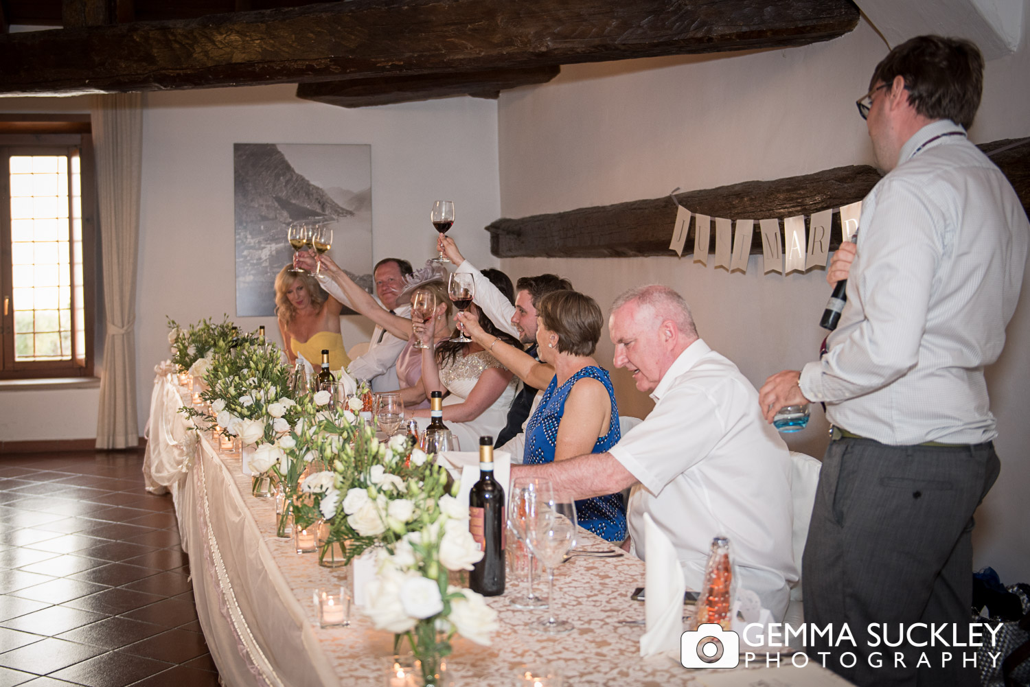 wedding guests toasting the bride and groom