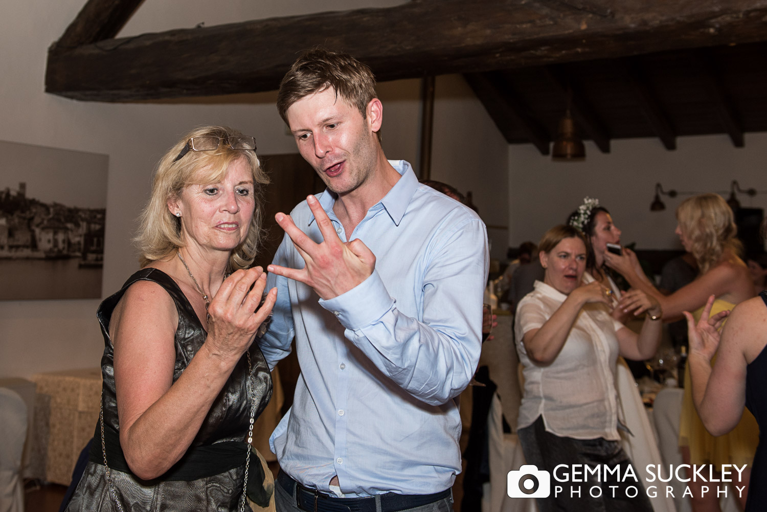 wedding guests dancing during wedding reception