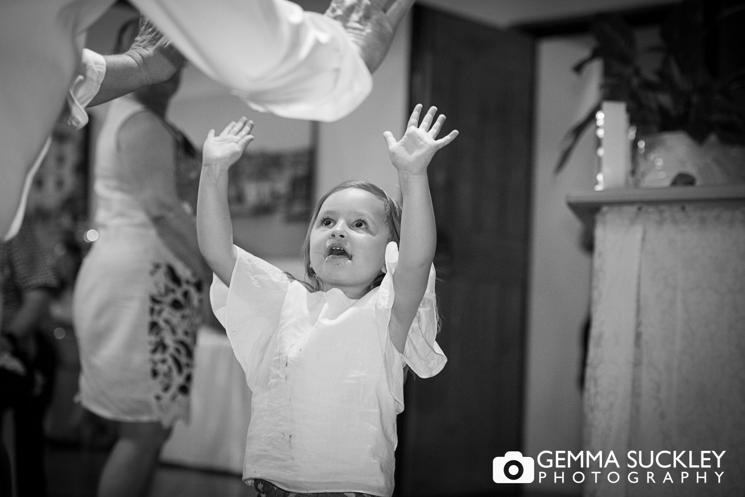 little girl dancing at wedding reception