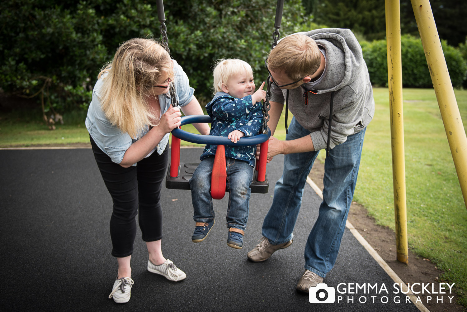 Little boy hugging his dad during a family photo shoot