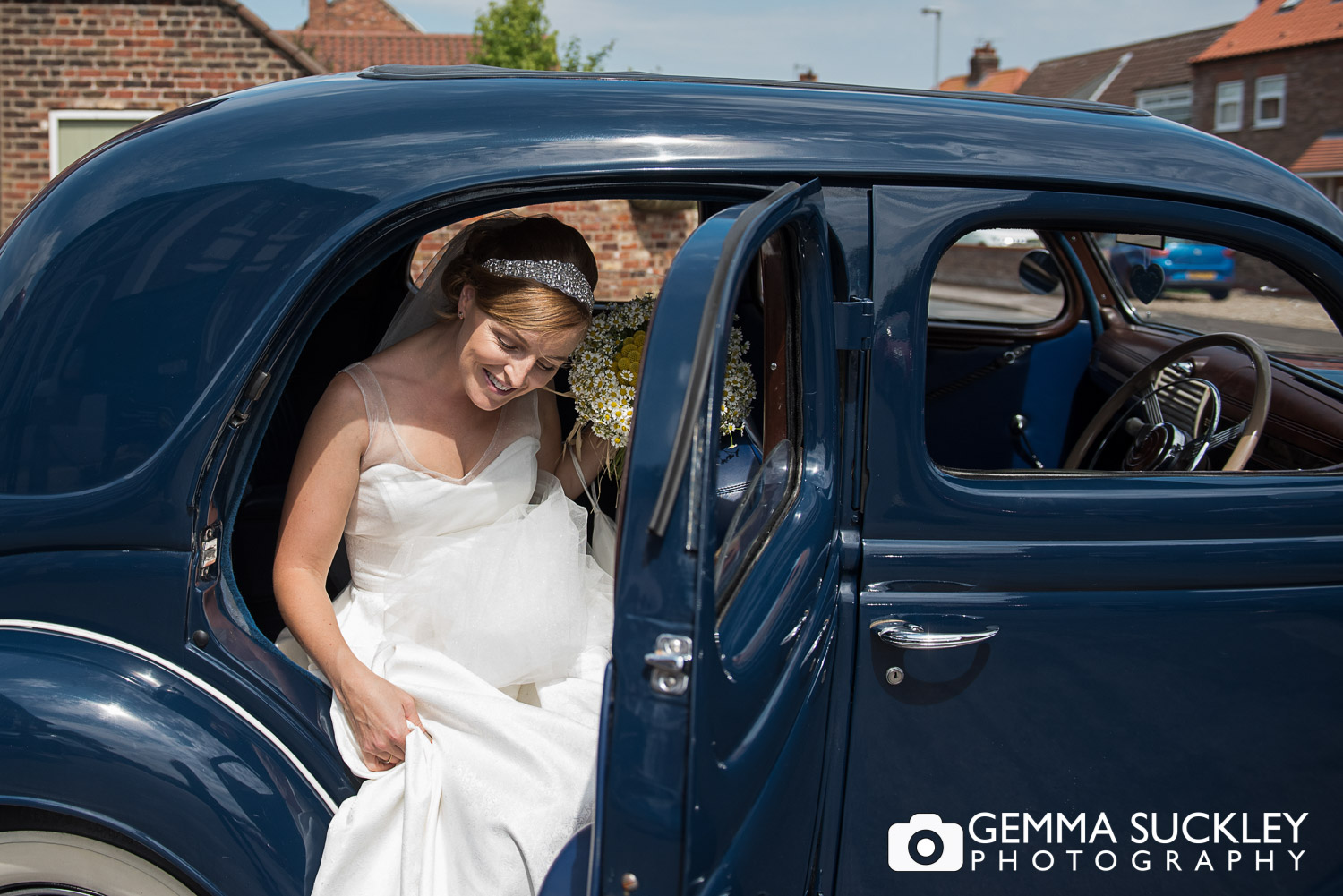 Bride getting out of the car for her wedding in Driffield