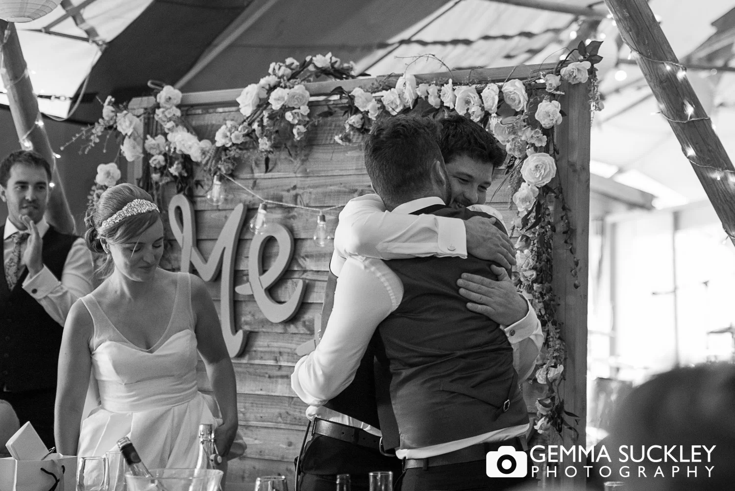 groom hugging his best man at oaklands, East Yorkshire