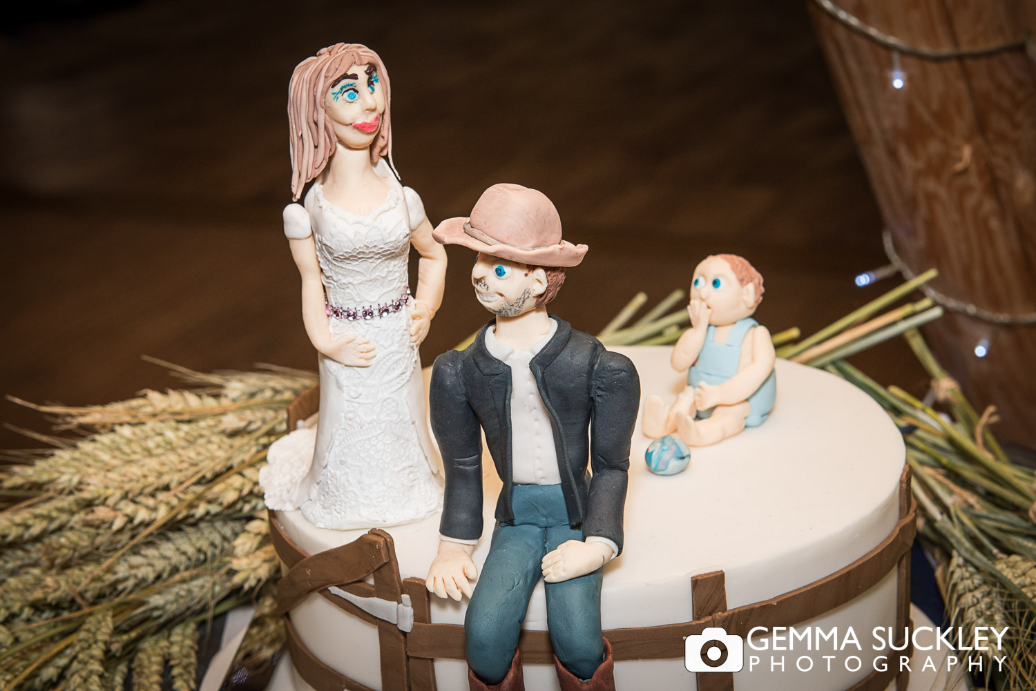 themed wedding cake of bride and groom