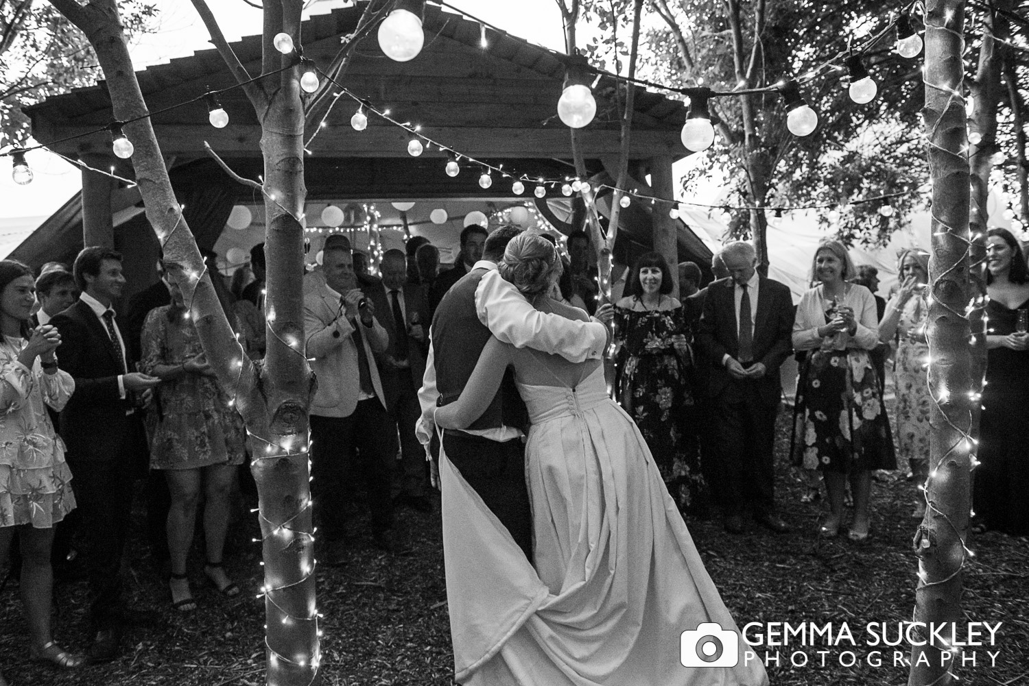 bride and groom with their wedding guest at Oaklands