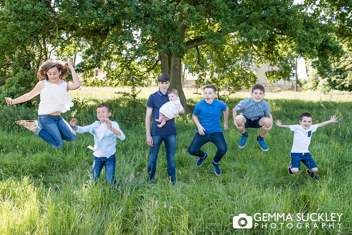 fun family photo of kids jumping