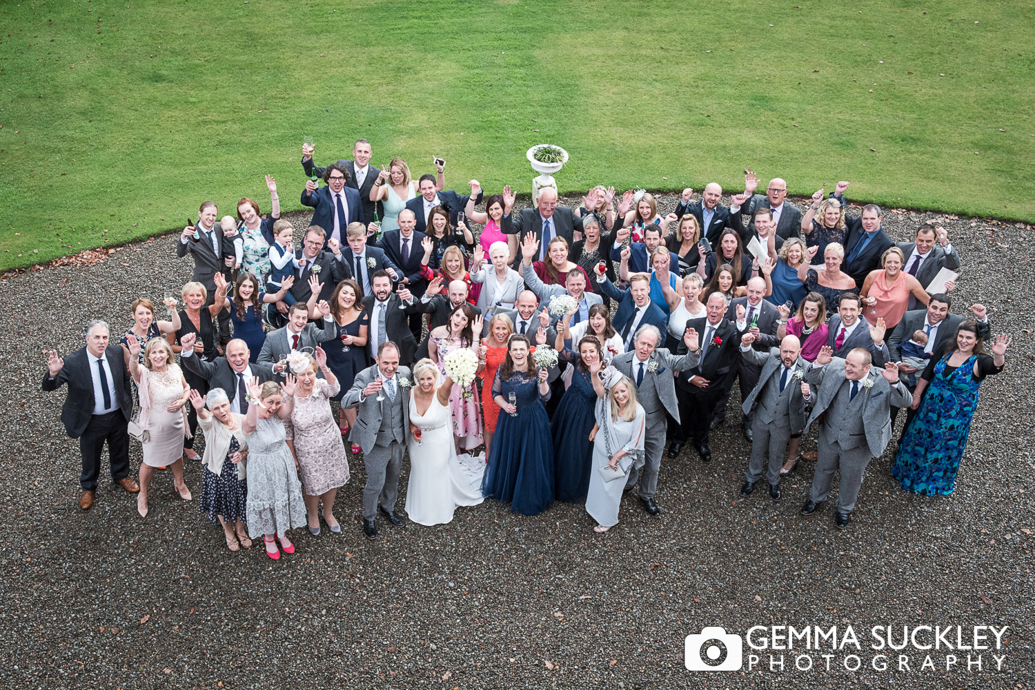 Group photo from above of all the wedding guests from the window of Belmount Hall