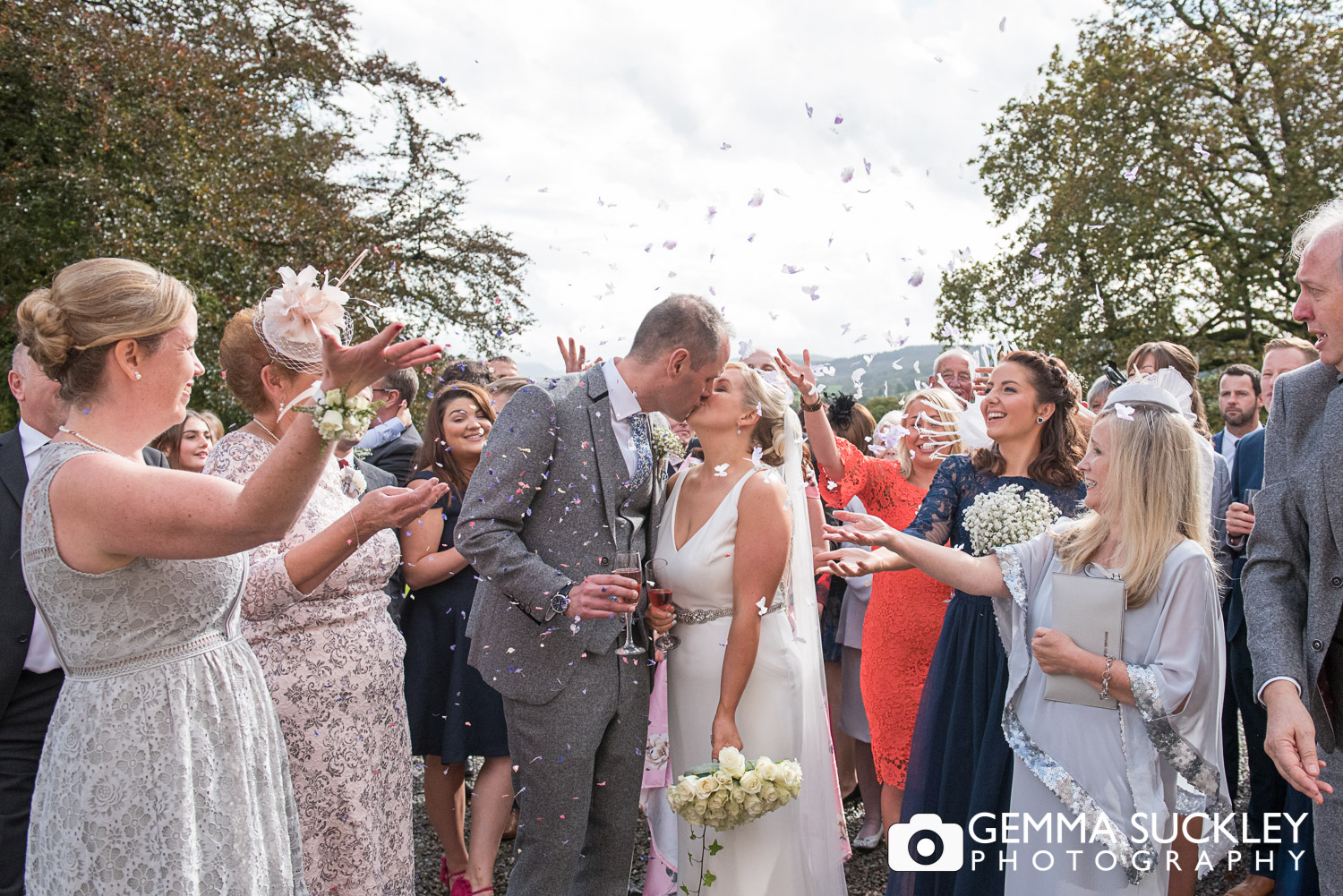 wedding guests throwing confetti outside belmount Hall