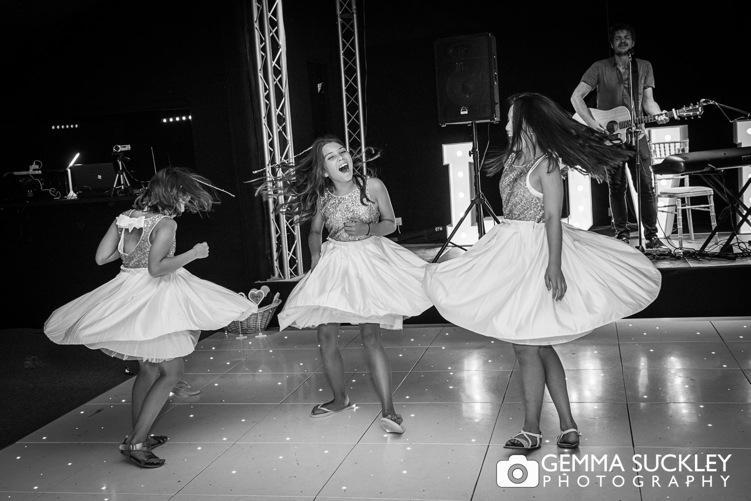 flower girls dancing at wedding reception 