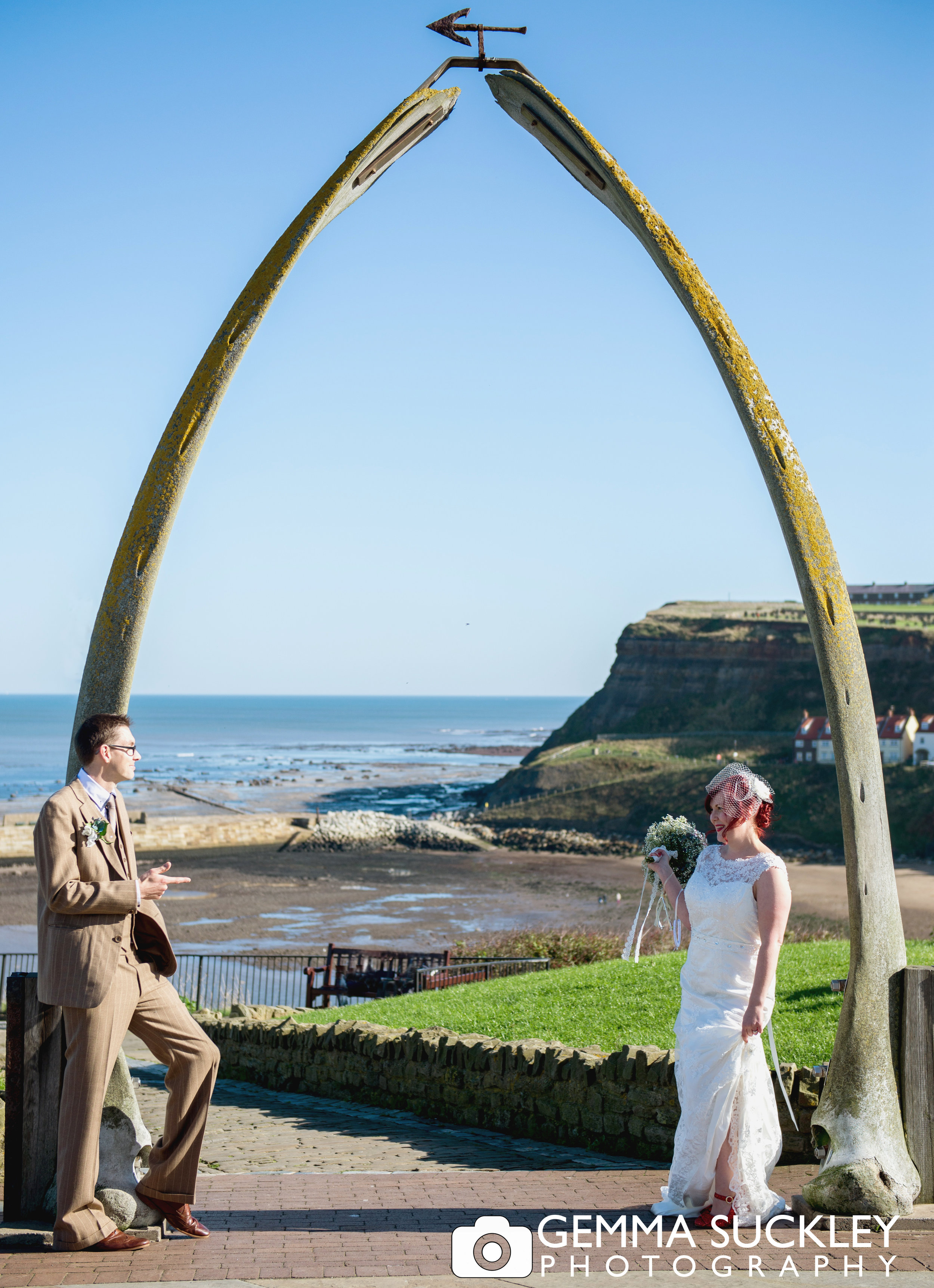 bride and groom under whitby whale bones