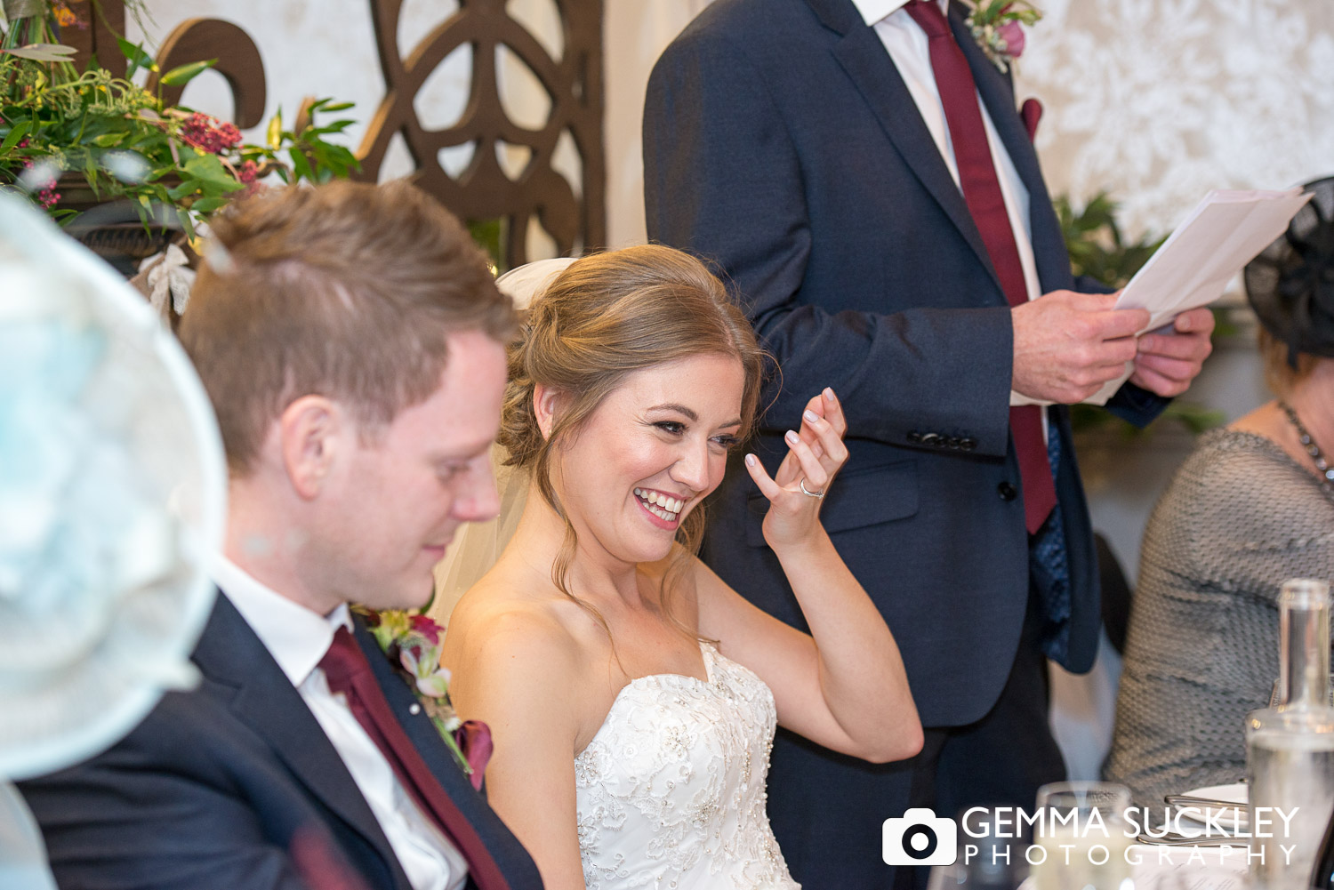bride laughing at speeches at Grassington House