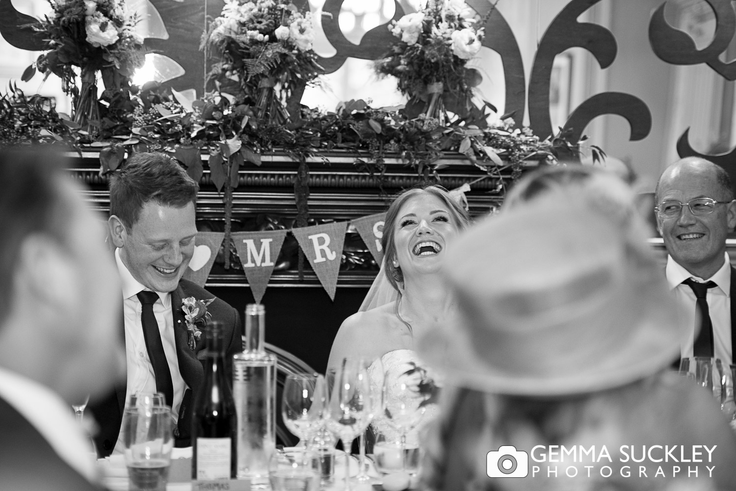 bride and groom laughing during specches