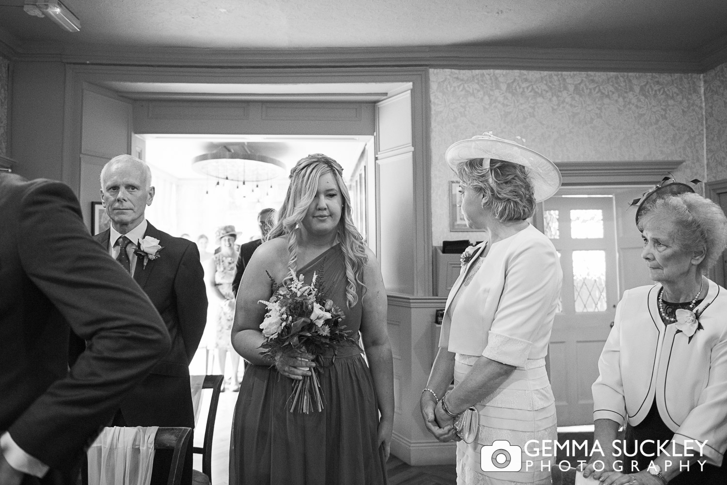 Bridesmaid walking down the aisle at Grassington house wedding