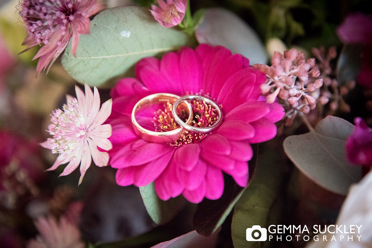 wedding rings presented on wedding flowers