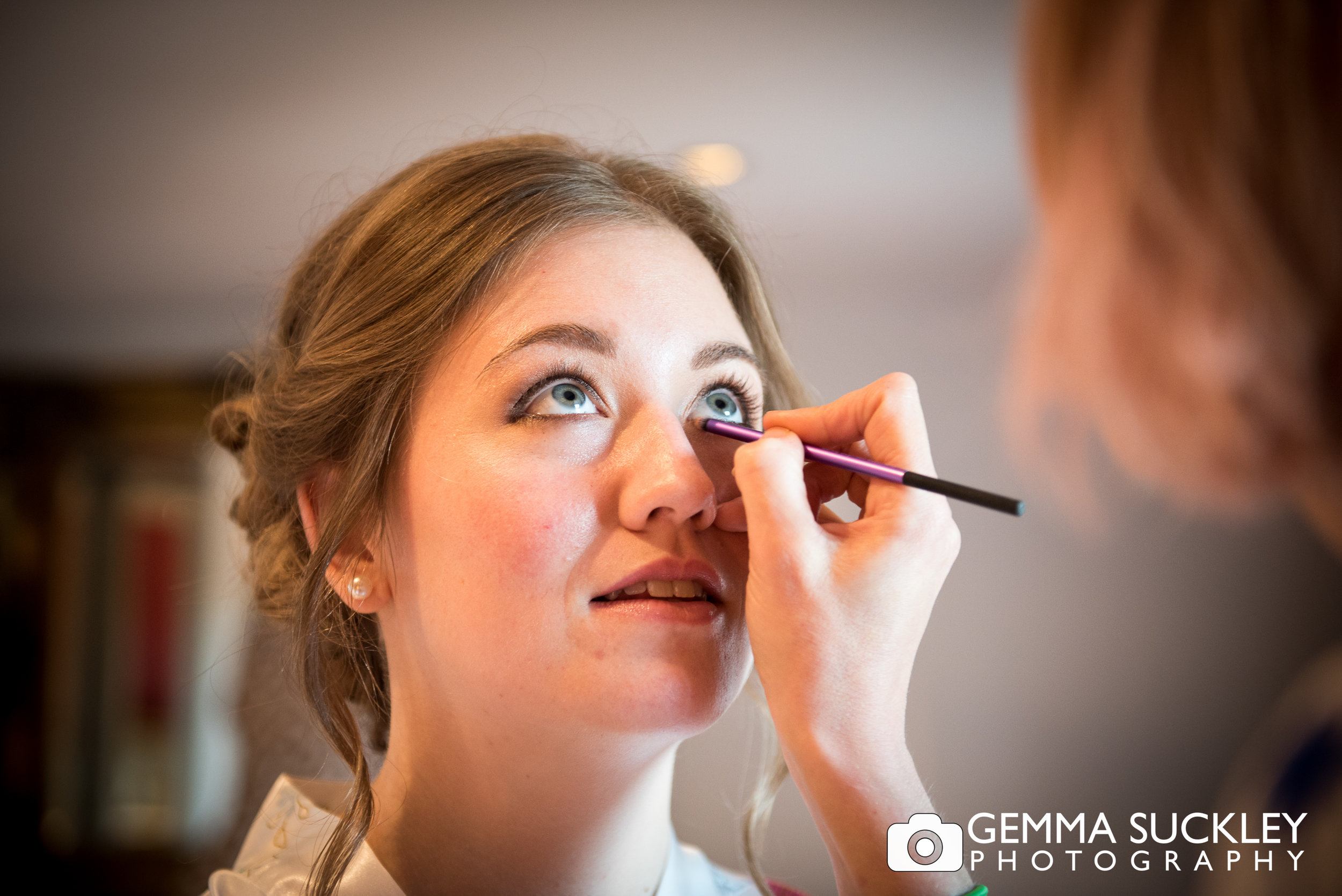 Bride getting make-up done