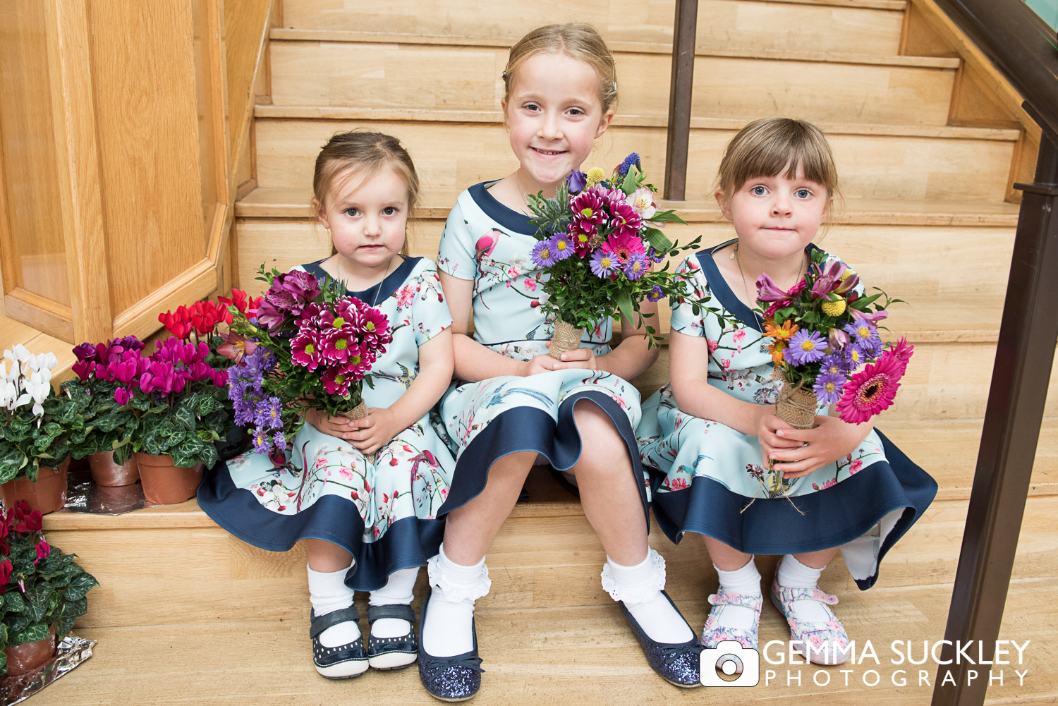 flower girls sat on the steps at Sun Pavilion 