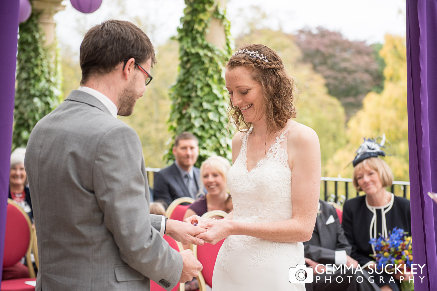 Bride and Groom exchanging wedding rings